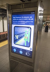 Safety message on OTG kiosk urging caution to players of Pokmon Go, at the 14 St-Union Sq station on Fri., July 15, 2016. Photo: Marc A. Hermann / MTA New York City Transit